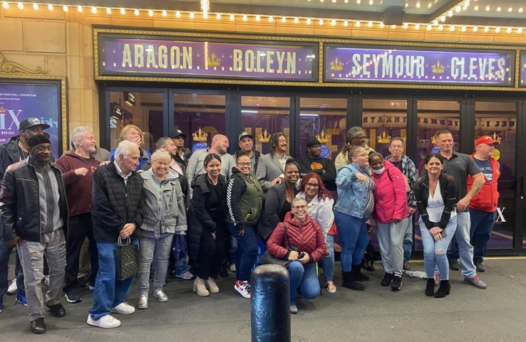 Vicki Bello with a group of Veterans Theatregoing Program participants at SIX on Broadway